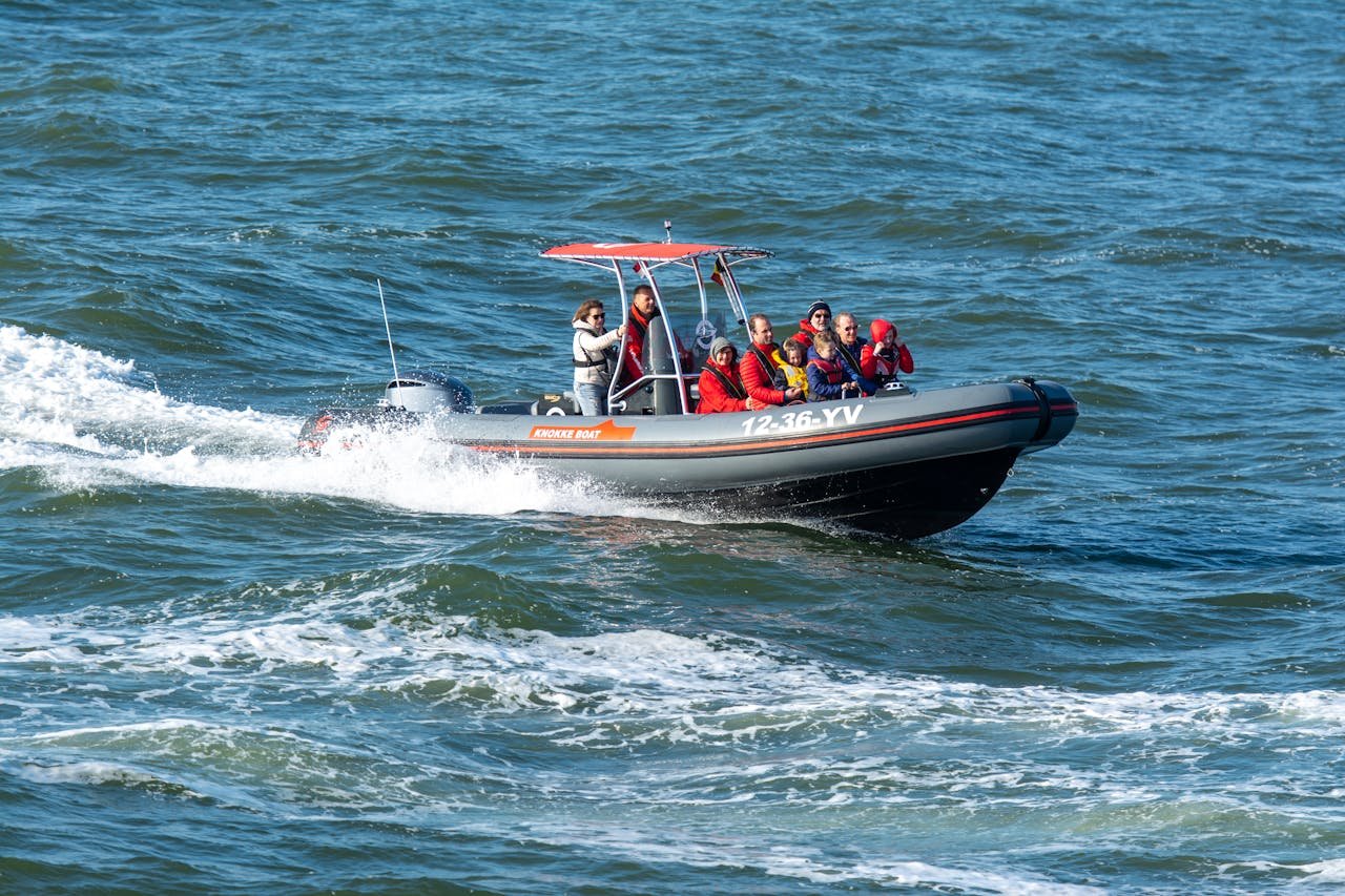 Crafting Captivating Headlines: Your awesome post title goes here Group of tourists having an adventure ride in an inflatable boat on a sunny day.